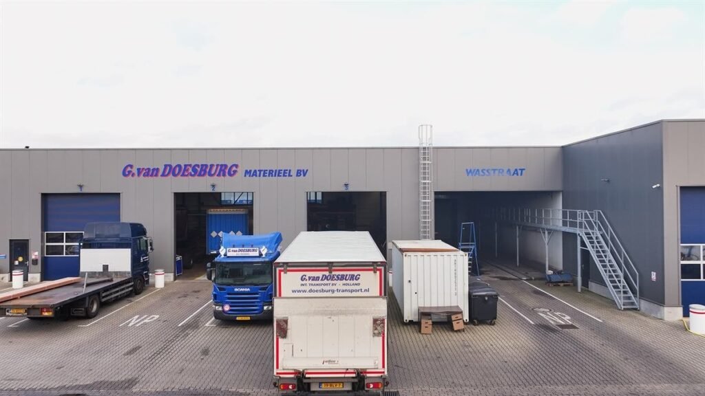 Trucks and trailers at the loading docks of a warehouse